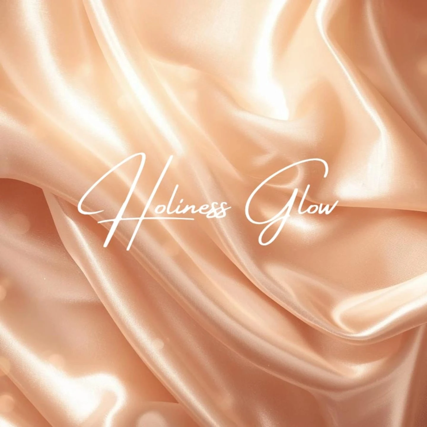 Holiness Glow white logo on peach satin